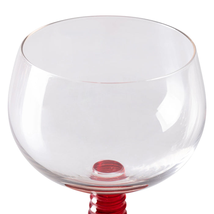 detail of a retro style wine glass with a red stem