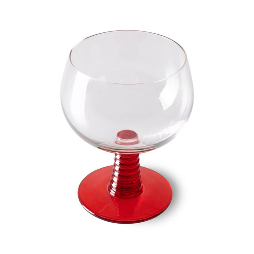 retro style wine glass with red colored low stem