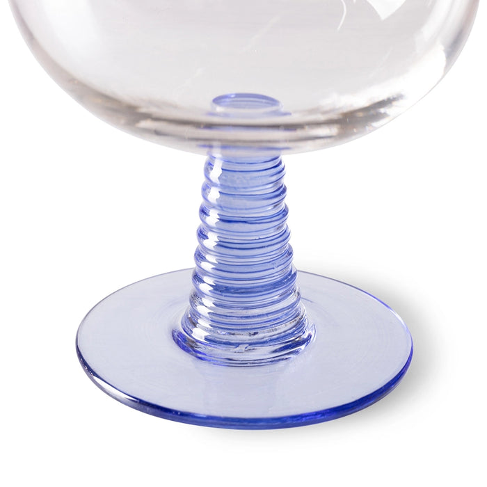 detail of blue colored low stem of the retro style wine glass