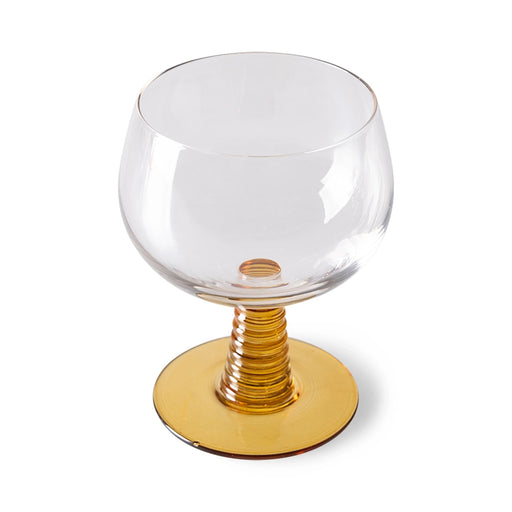 retro style wine glass with ochre colored low stem