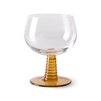 retro style wine glass with ochre colored low stem