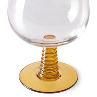 retro style wine glass with ochre colored low stem