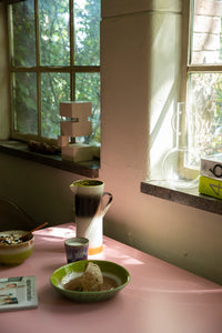 white mahogany wooden Bauhaus inspired sculpture in a window setting