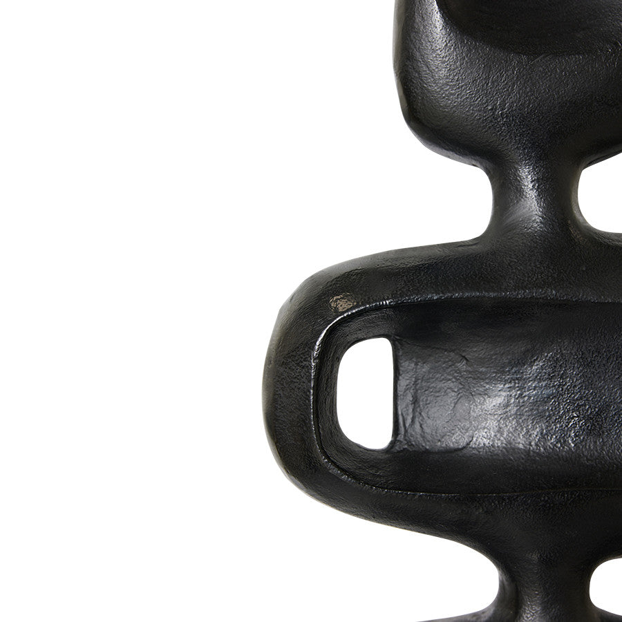 detail of tall black aluminum handmade sculpture 