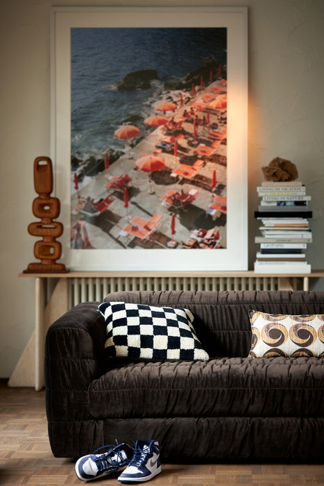 framed photo of orange parasols at Amalfi Coast in a living room
