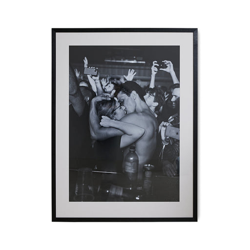 framed black and white photo of boy and girl kissing