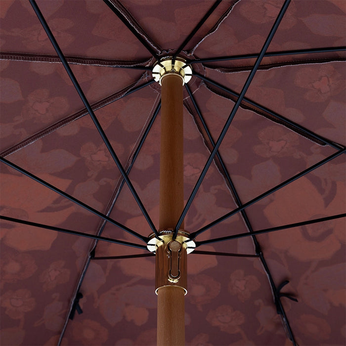 inside of retro style parasol with flower fabric and blue fringes