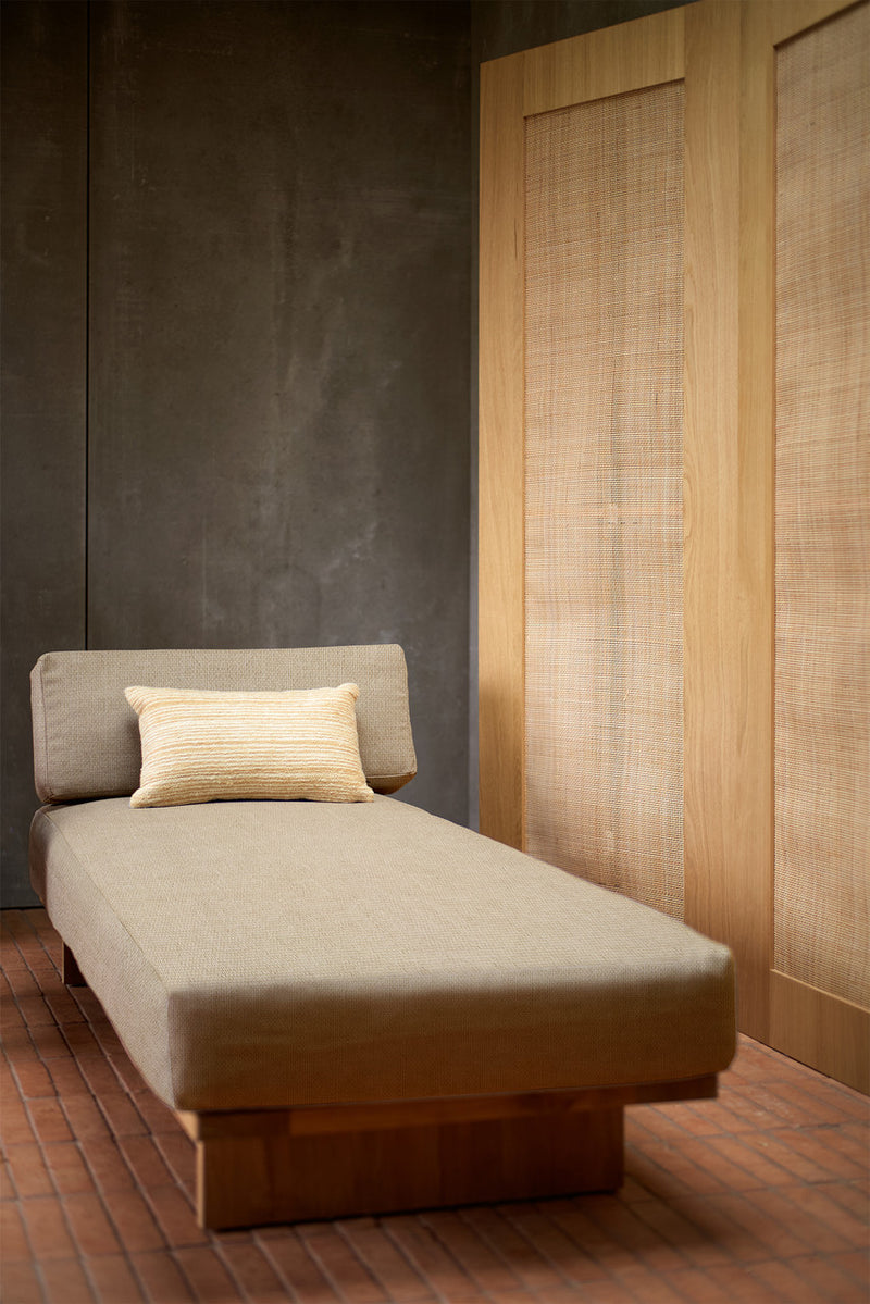 teak wooden day bed with beige cushion