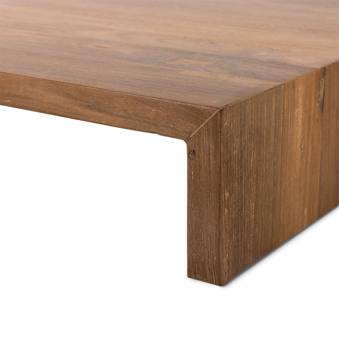 detail of corner of teak wooden plateau table