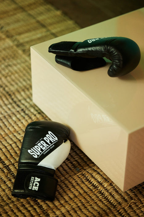  square clay color mirror block table with black boxing gloves