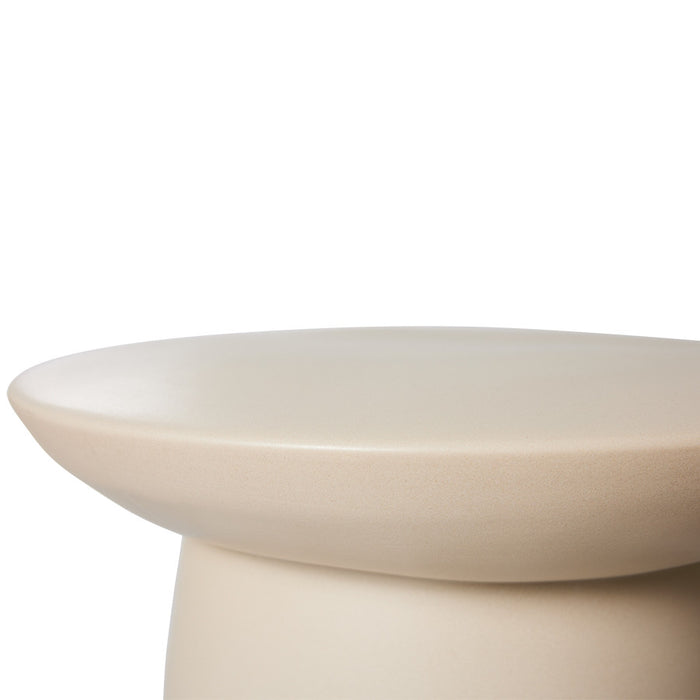 detail of sculpture like earthenware accent table
