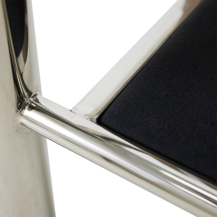 detail of base from chrome armrest chair
