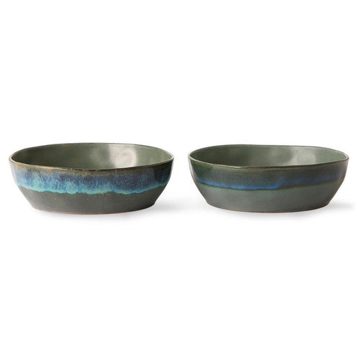 stoneware bowls in a matte green color with blue accents