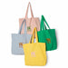 4 cotton shopping bags in pink, green, blue and yellow with contrasting colored HKliving logo