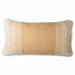 large hand woven wool lumbar pillow in camel and cream with a white and green piping