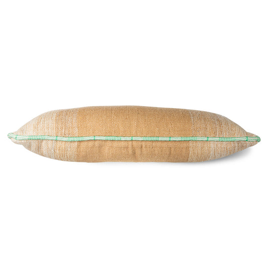 large hand woven wool lumbar pillow in camel and cream with a white and green piping