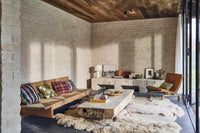 large sofa with checkered retro style throw pillows