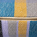 detail of retro style colored lumbar pillow made from soft cotton and woven into checker pattern