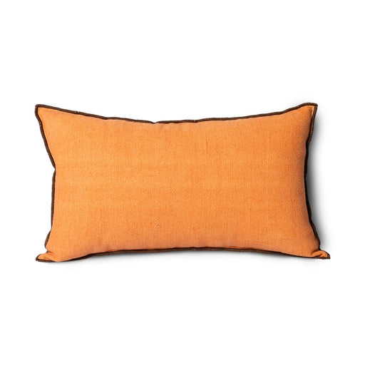 orange linen lumbar pillow with brown cotton trim