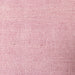 close up of linen fabric of pink linen lumbar pillow with red cotton trim