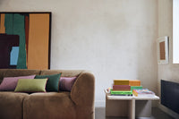 brown corduroy element couch with pink and green lumbar pillows in two sizes