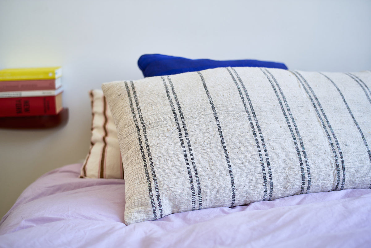 natural cotton thin striped super large pillow on bed