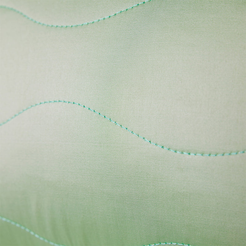 detail of fabric with green stitch