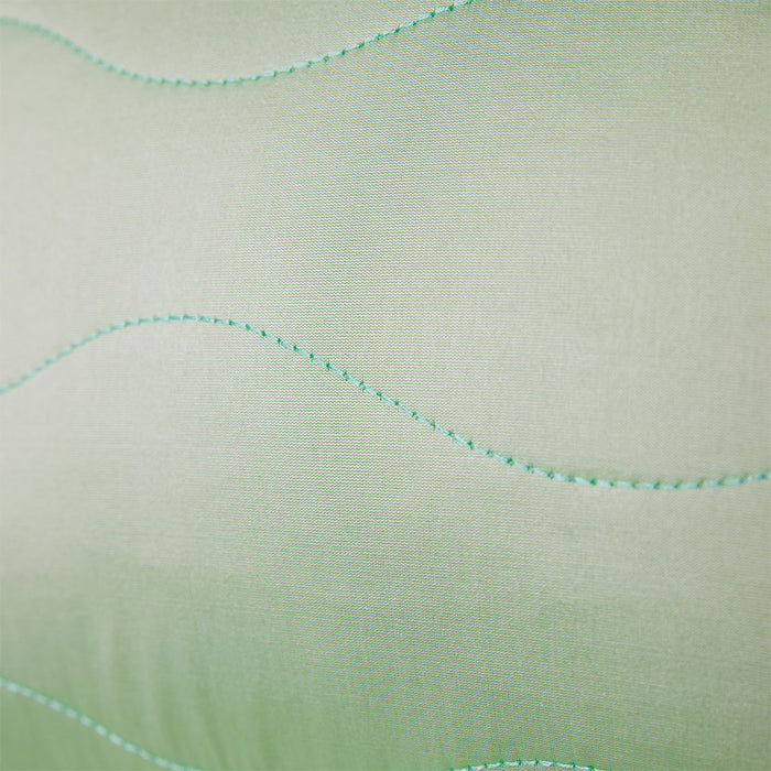detail of fabric with green stitch