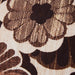 close up of fabric vintage inspired lumbar pillow with brown flowers