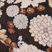 close up fabric brown vintage inspired lumbar pillow with flower print 