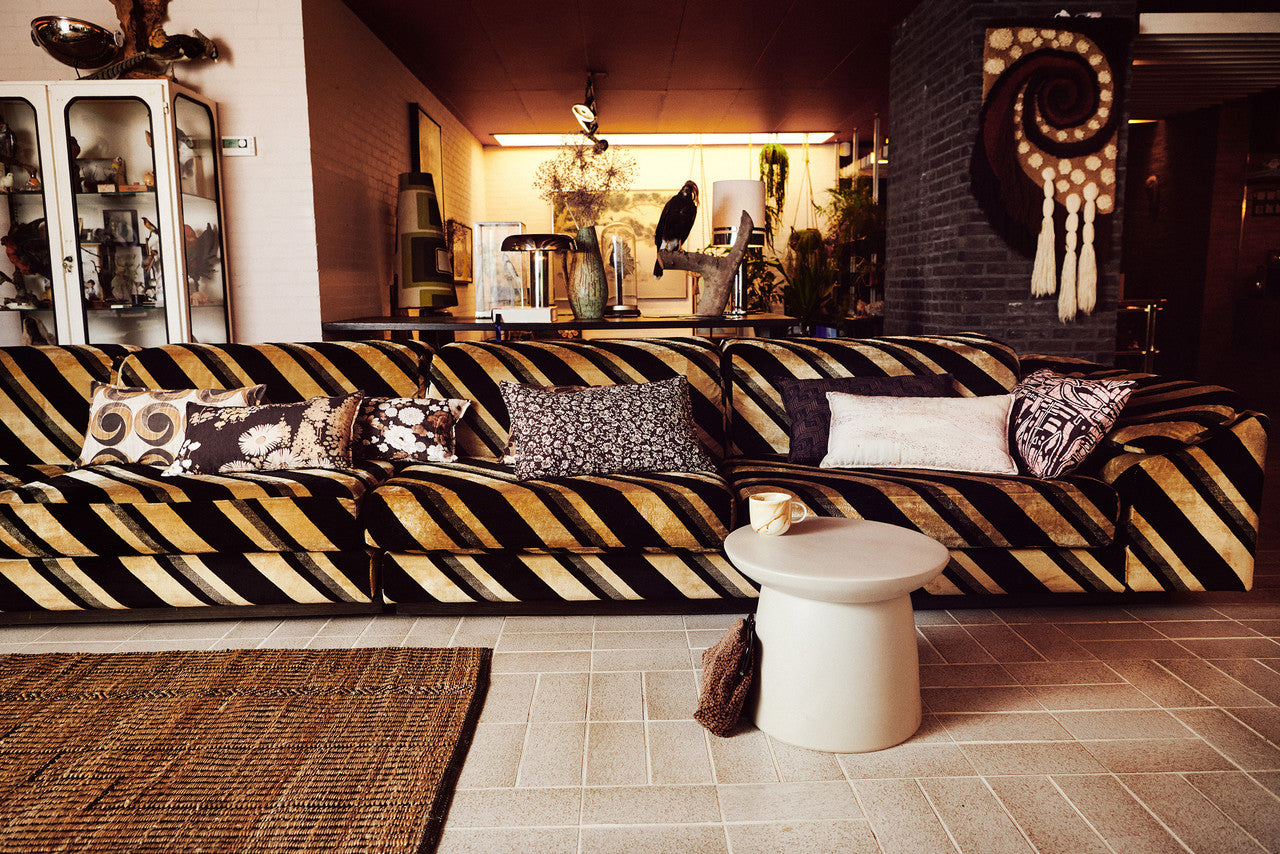 retro style velvet sofa with lumbar pillows in brown