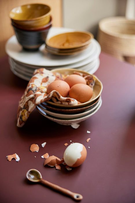 eggs in a bowl with a cotton napkin