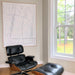 Eames chair and large white framed painting