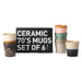 six different style and color coffee mugs with a black gift box with white letters 