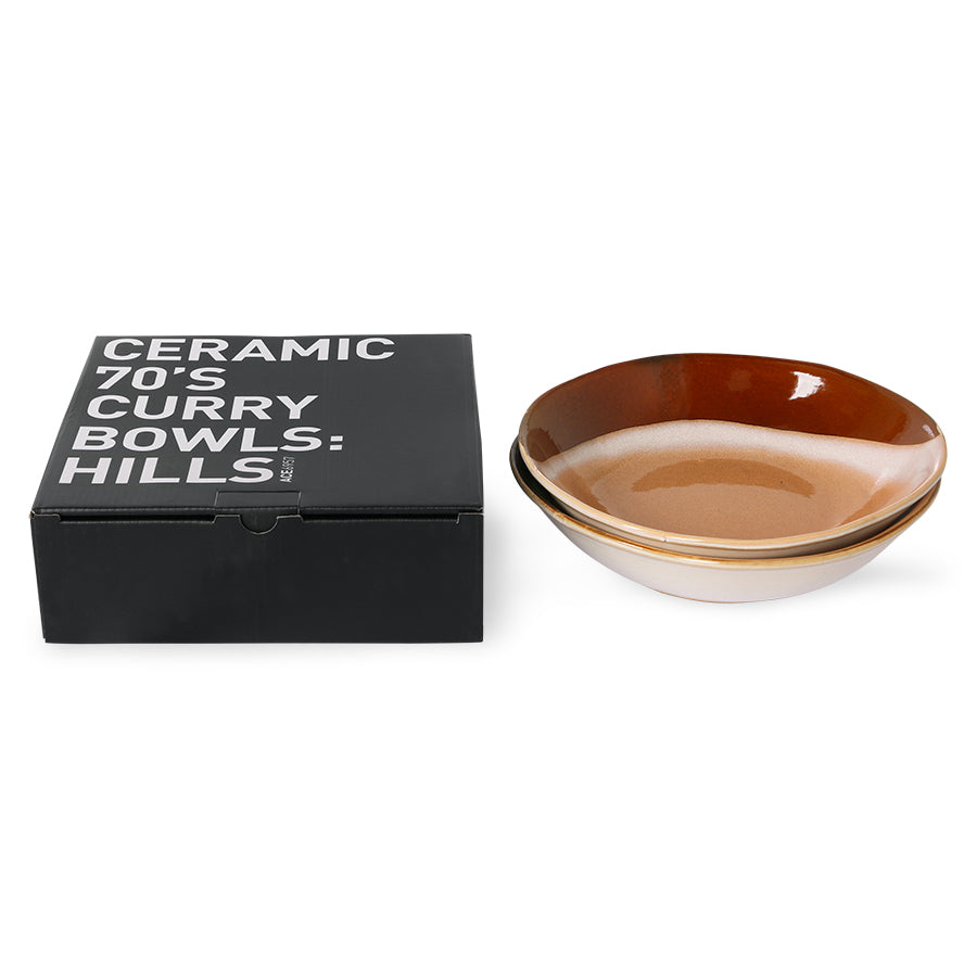 black box and two stoneware curry bowls with orange and terra colored finish