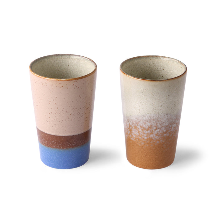 tall, slim ceramic mugs for tea in blue and brown color tones
