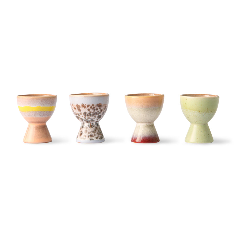 4 egg holders in soft pastel colors peach, orange, red and green