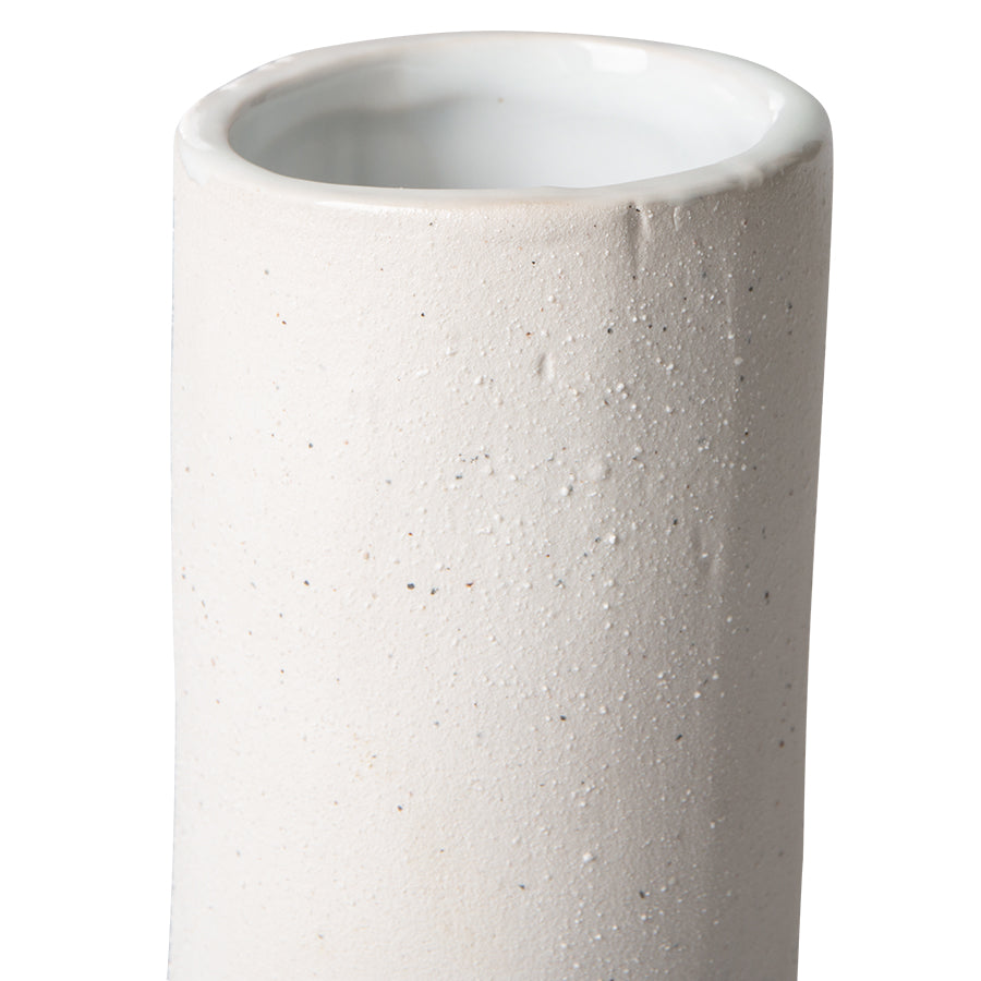 detail of textured finish on a white sculptural twisted vase