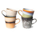 multi colored coffee mugs with an ear made from stoneware in orange, green, brown and cream