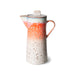 tall orange and cream colored textured finished stoneware coffee pot