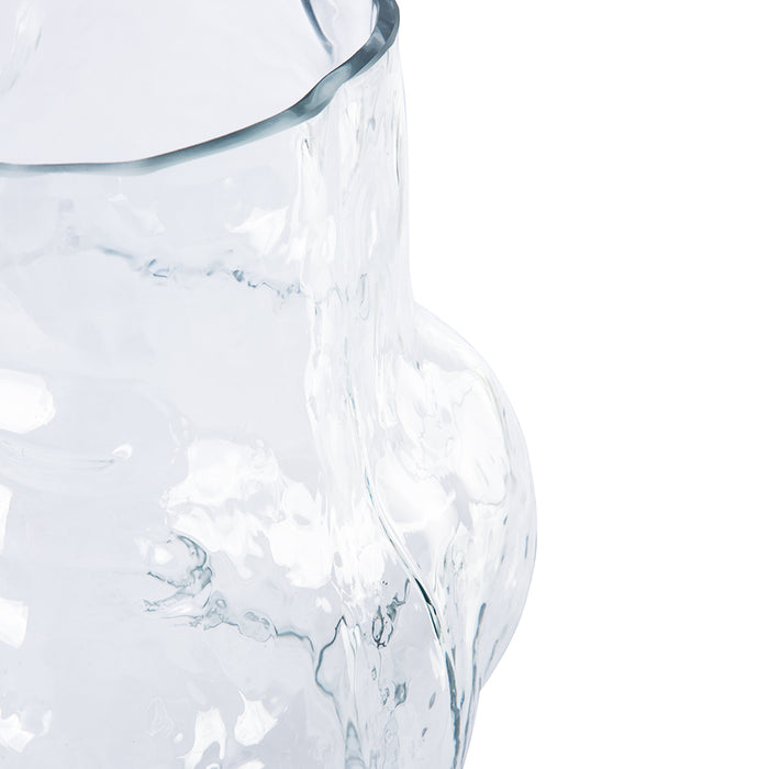 detail of tall clear glass cloud shaped flower vase
