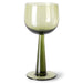 green colored wine glass on tall stem