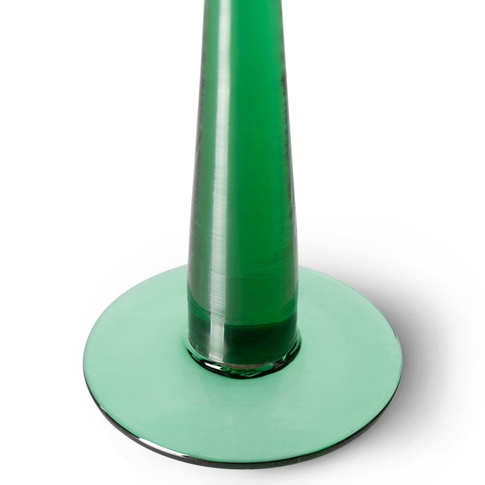 detail of green colored tall stem wine glass