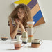table with ceramic coffee mugs by hkliving