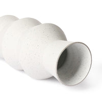 close up clay vase white speckled