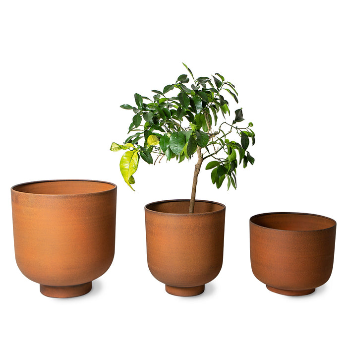 set of 3 planters made from metal in a terracotta color
