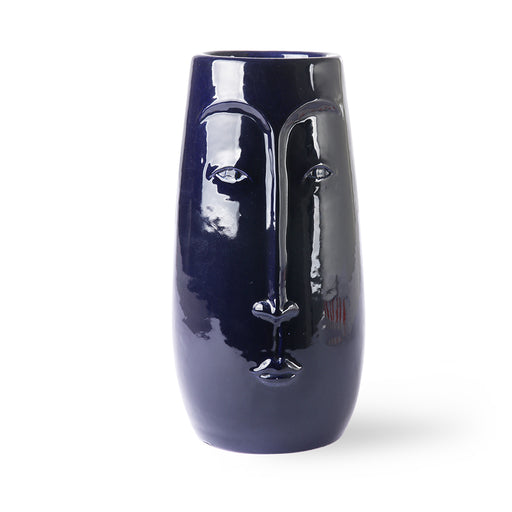 tall blue vase with face