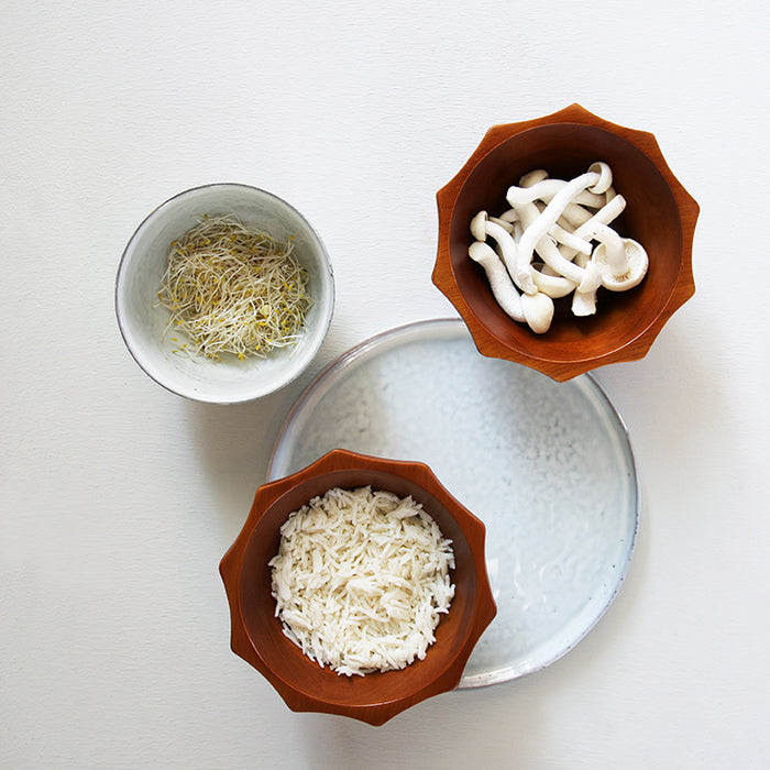 white breakfast plate and wooden bowls with rice and mushrooms