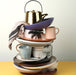 stack of colorful ceramics including a natural linen striped napkin