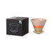 black box with off white, orange and yellow colored, ceramic coffee filter